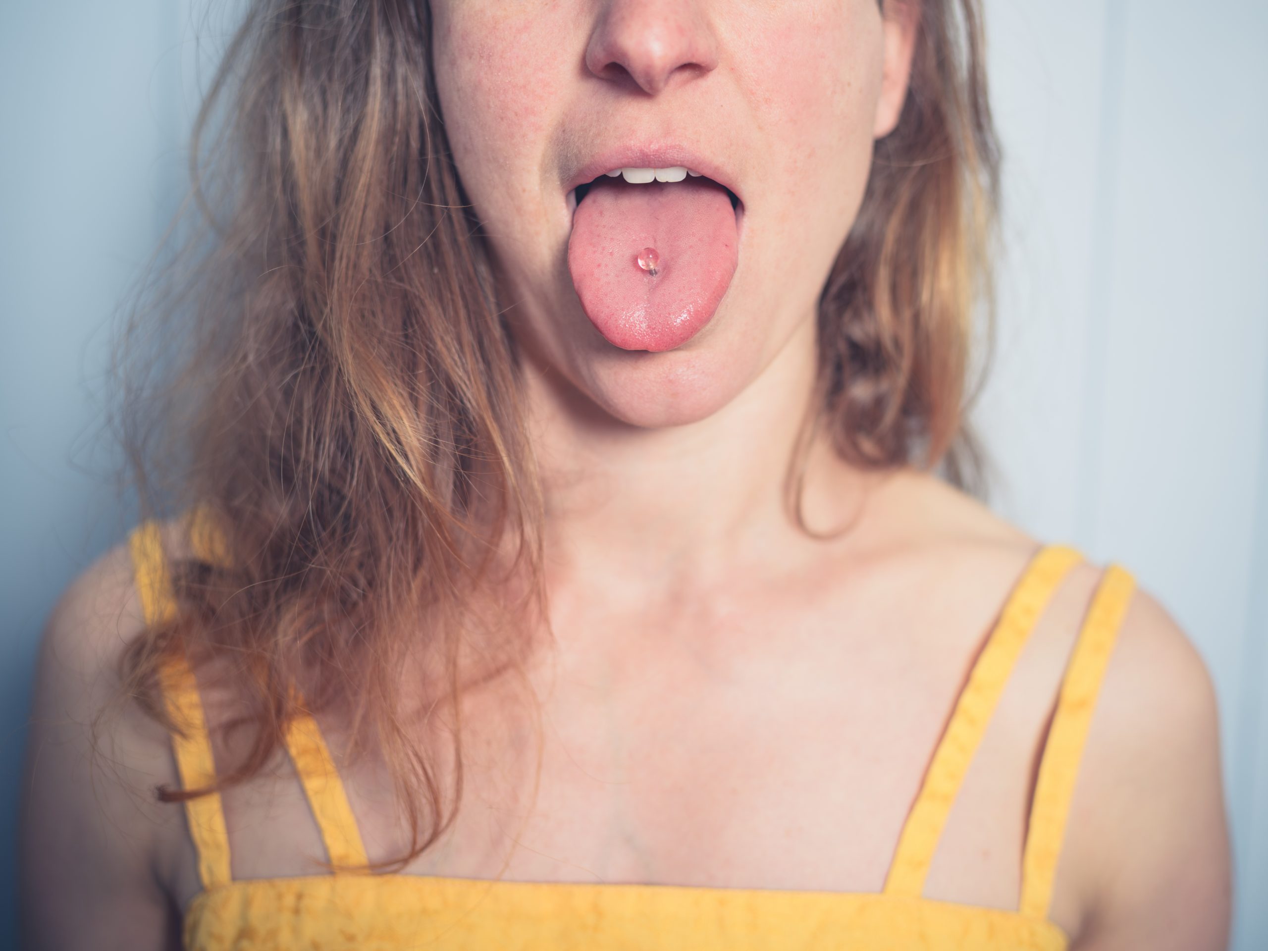 Woman with tongue piercing