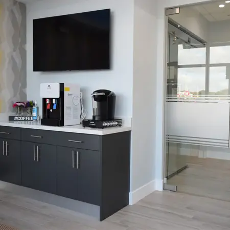 Office refreshment area and treatment hallway.